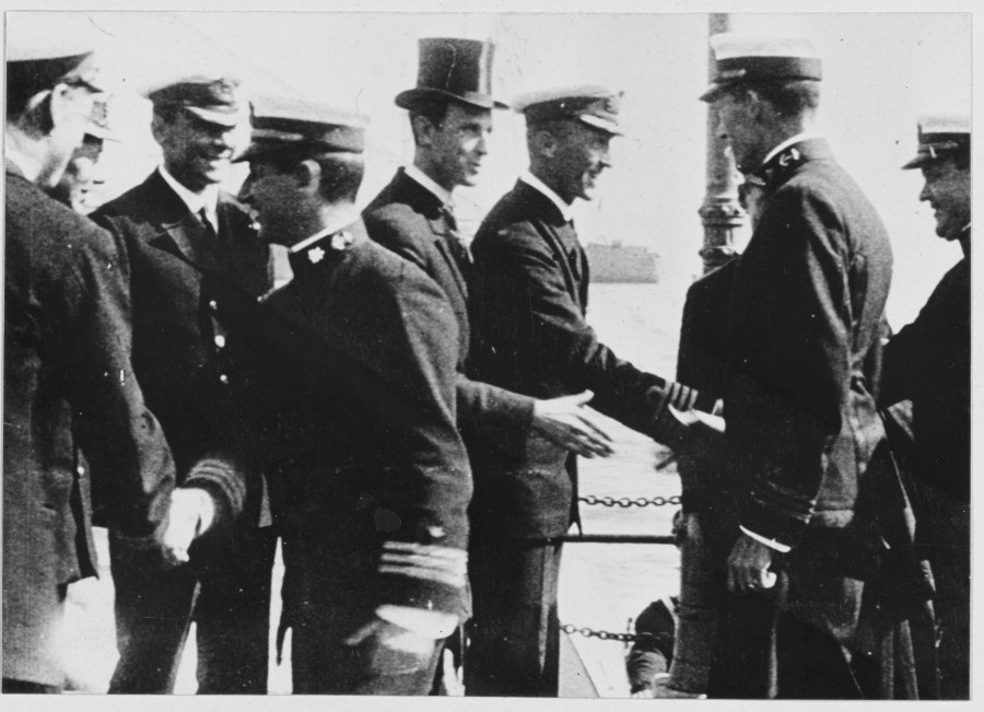 893b. Mr Wesley Frost, American consul, and British Naval officers greeting Commander Taussig and the other officers of the destroyer flotilla upon their arrival in Queenstown, May 4, 1917.