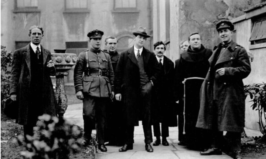 1141a. Michael Collins at St Francis Church, Broad Lane, Cork, on Sunday, 12 March 1922, before the rally at the Grand Parade; (left to right) Diarmuid Fawsitt, economic advisor during the Treaty negotiations; Commandant Cooney, Michael Collins, T.D. Padraig O'Keeffe T.D., Fr Leo Sheehan, Very Rev. Fr Edmund Walsh and General Seán Mac Eoin (picture: Cork City Library).