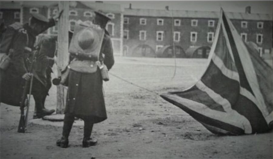 1151a. The British army, in Victoria (now Collins) Barracks Cork, taking down the Union Jack flag for the last time, 18 May 1922 (source: Kilmainham Gaol Museum).